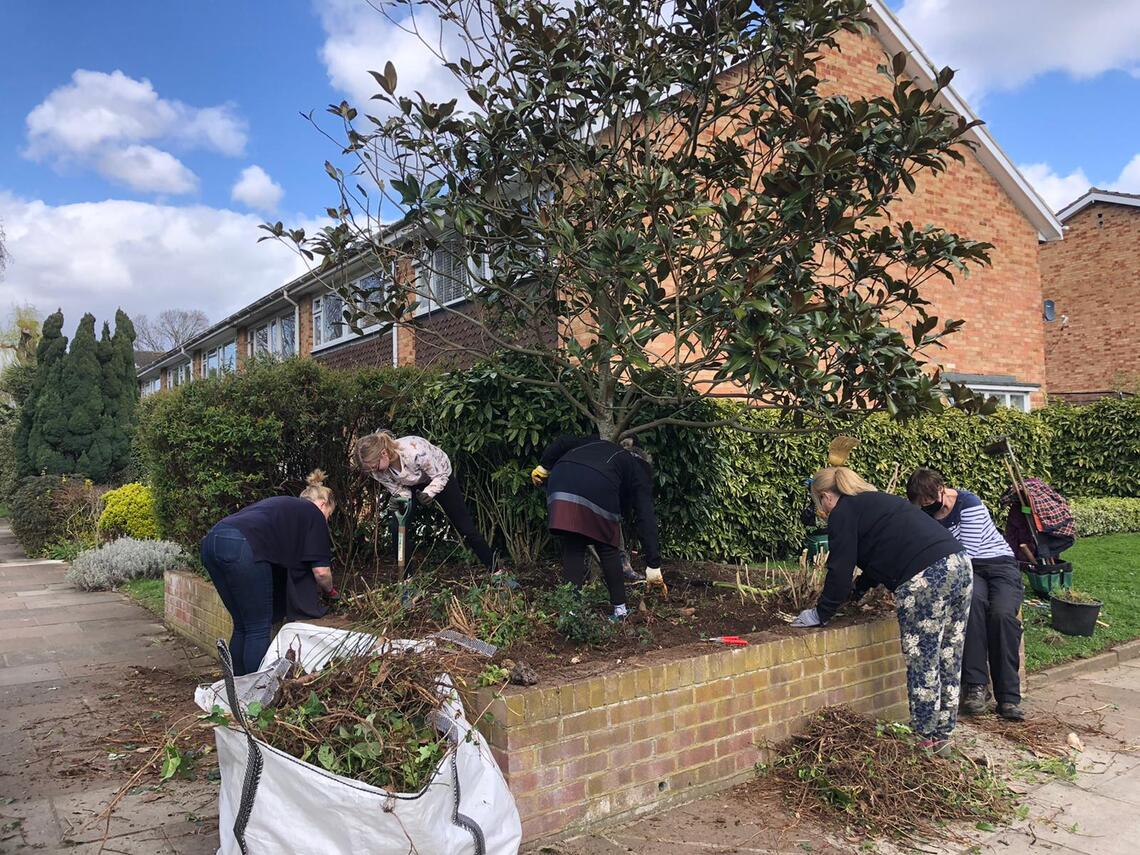 Group of volunteers working on a raised bed