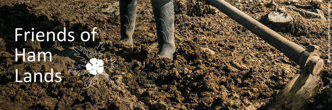 Man digging in wellies